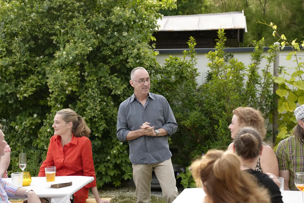 Guests talking at a summer garden gathering
